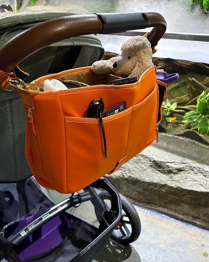 Sarah Wells Stroller Caddy & Pump Bag – Insulated Neoprene Diaper Organizer with Crossbody Strap, Machine Washable, Luggage Sleeve – Fits Single & Double Strollers (Orange)