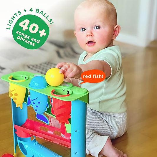 Move2Play, Feed The Fish | 30+ Fin-Tastic Songs & Phrases | Baby & Toddler Musical Toy | First Birthday Present for 1+ Year Old | Ages 6-24 Months | Boy & Girl Ball Drop Toy