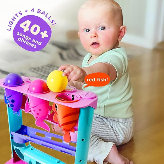 Move2Play, Feed The Fish | 30+ Fin-Tastic Songs & Phrases | Baby & Toddler Musical Toy | First Birthday Present for 1+ Year Old | Ages 6-24 Months | Boy & Girl Ball Drop Toy
